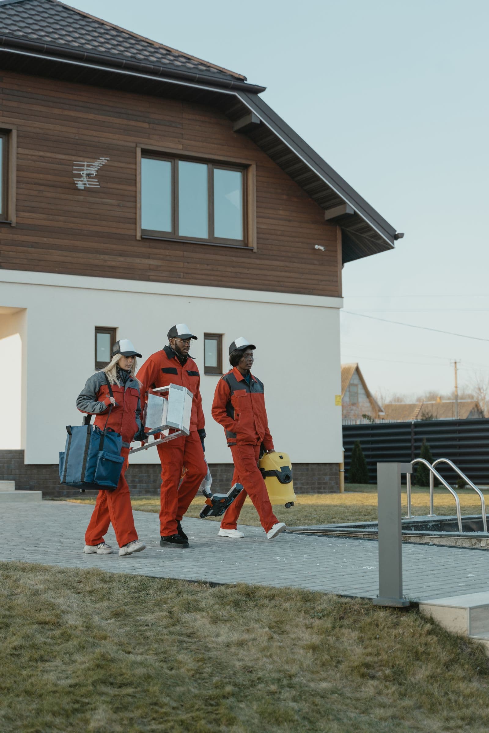 A professional cleaning team arriving with equipment
